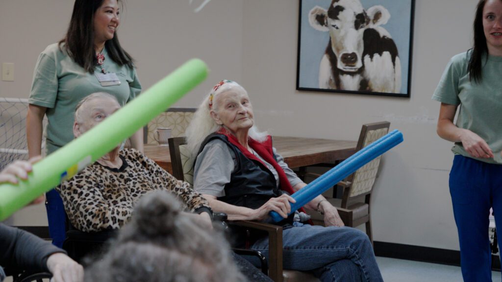 A group of people doing an activity at a skilled nursing facility