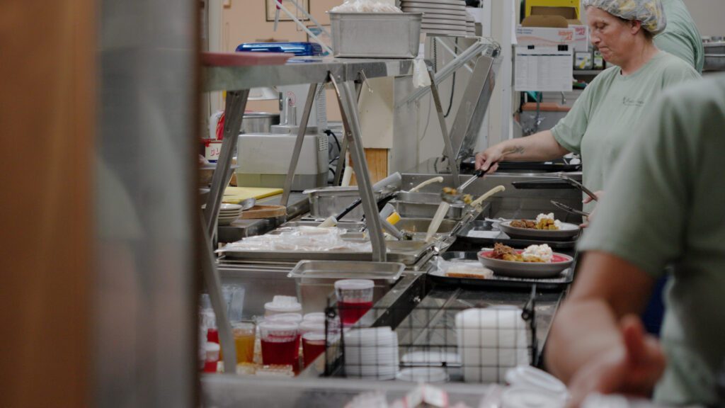 A kitchen staff at a skilled nursing facility